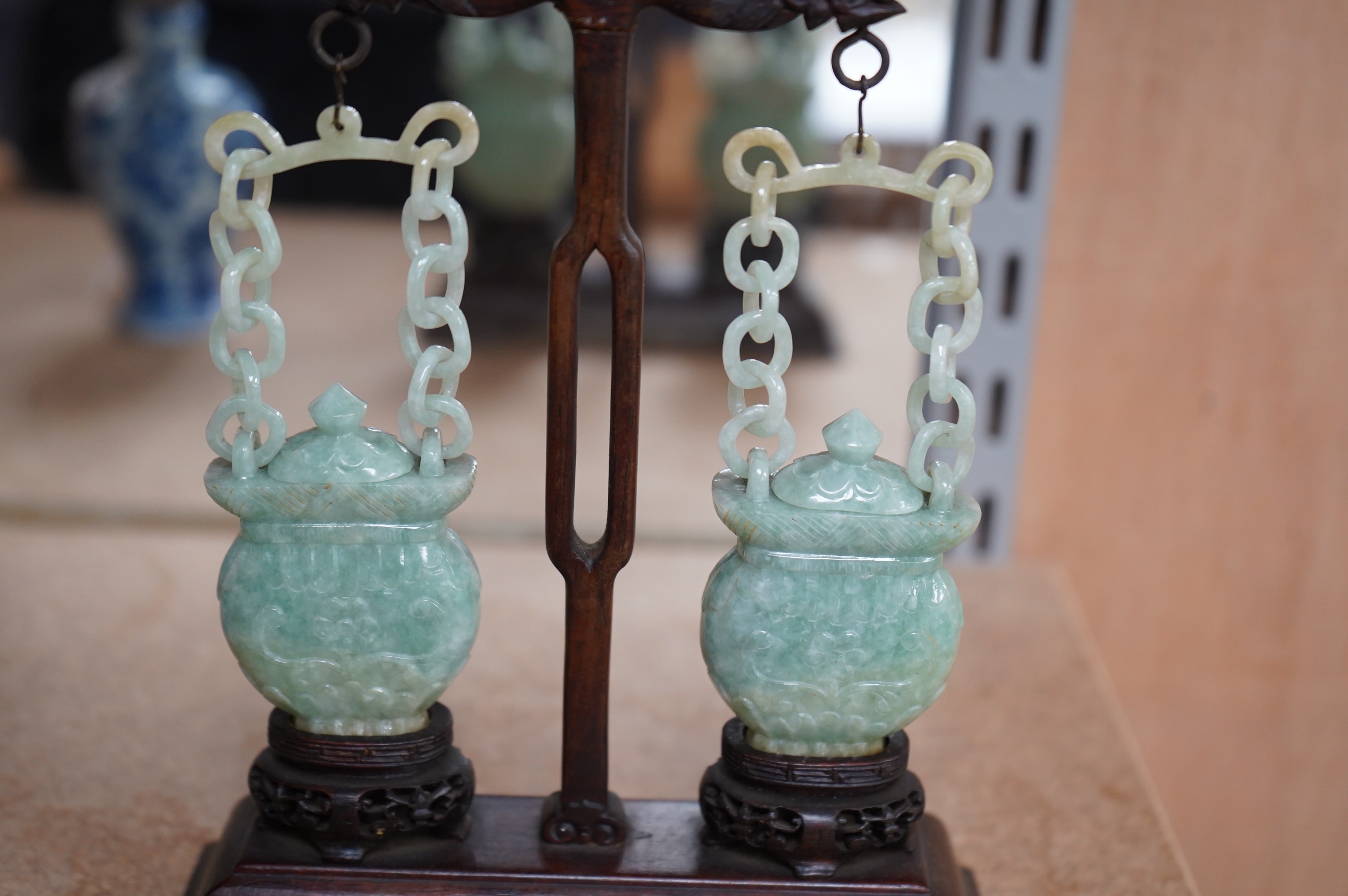 A pair of Chinese jadeite hanging baskets and covers, with original stand and hanging support, first half 20th century, 18cm high. Condition - good